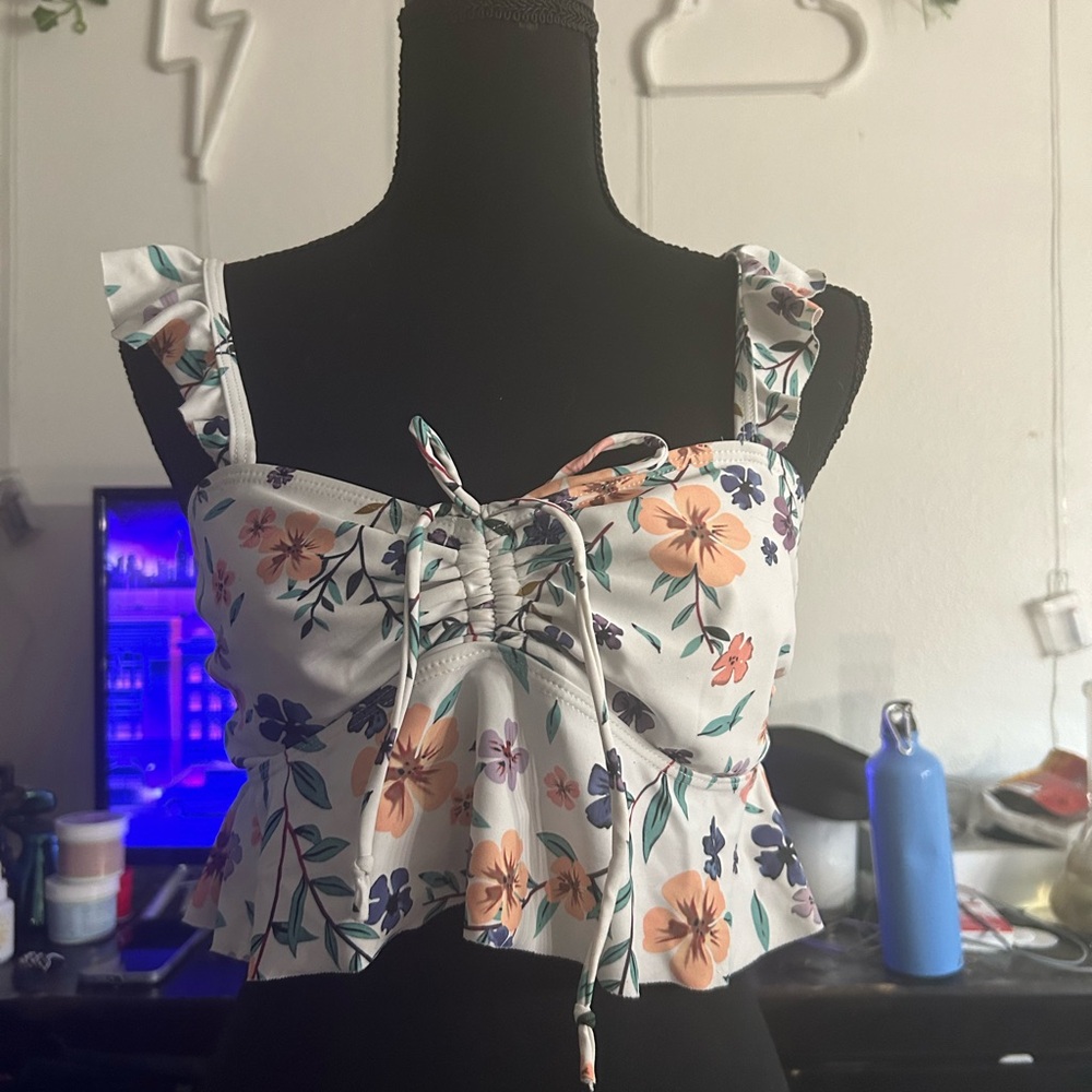 Cute bathing suit top that can be worn as a shirt, floral pattern, size small.